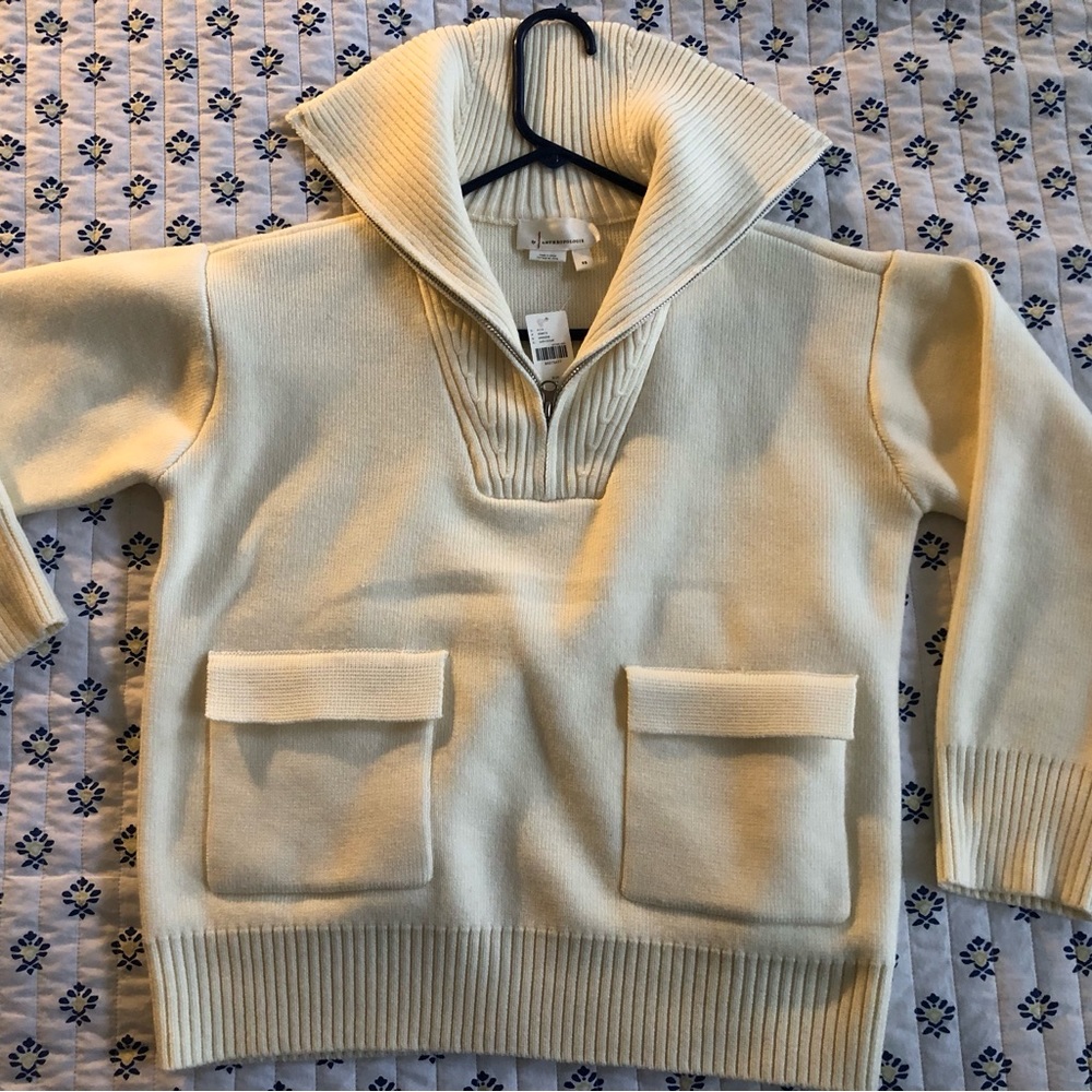 Brand new ivory cotton sweater from Anthropologie. Too small for my daughter.